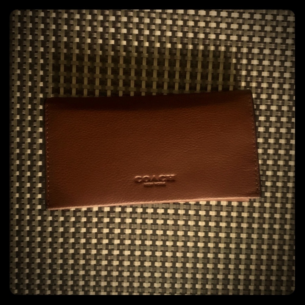 Coach leather wallet phone case.